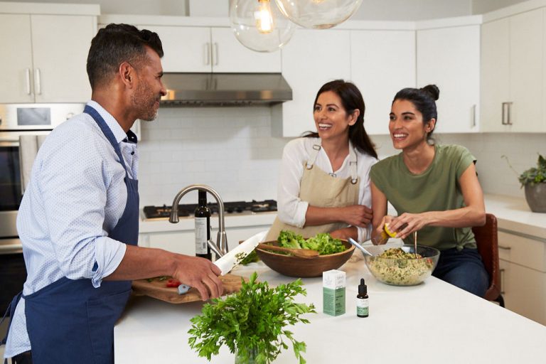 Family in Kitchen with Tincture Oil, cooking dinner